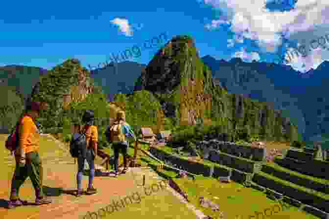 Hikers Trekking Along The Inca Trail With Machu Picchu In The Background Trekking Peru: A Traveler S Guide