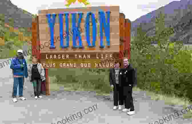 Niall Ferguson Posing In Front Of A Sign That Reads 'Welcome To The Yukon Territory' Yukon Wanderlust Niall Ferguson
